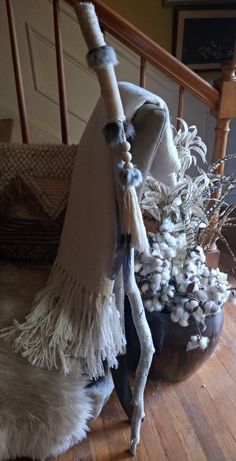 a pile of white stuff sitting on top of a wooden floor next to a banister