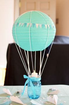 a blue hot air balloon sitting on top of a table