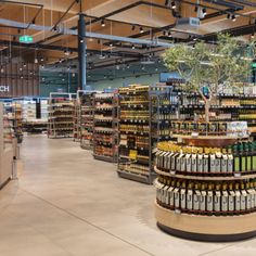 an empty grocery store filled with lots of bottles