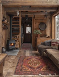 a living room filled with furniture and a fire place in the middle of a room