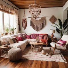 a living room filled with lots of furniture and decor on top of a hard wood floor