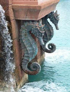 a water fountain with a statue of a sea horse