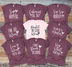 six t - shirts with sayings on them sitting next to each other in front of a wooden background