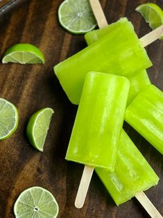 lime pops on a plate with slices of lime