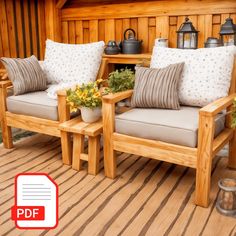 two wooden chairs sitting next to each other on a deck with potted plants and tea kettles