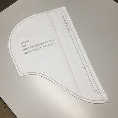 a piece of paper that has been cut in half and placed on top of it