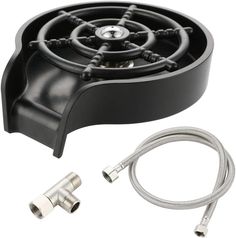 an image of a black stove top with hose