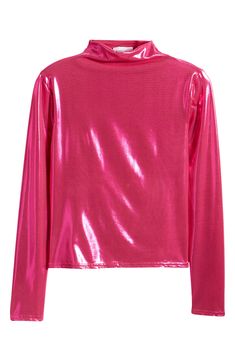 This mock-neck top is designed in a liquid metallic sheen for an elevated night-out vibe. Mock neck Long sleeves 95% polyester, 5% spandex Machine wash, line dry Made in the USA Solid Color High Neck Party Top, Fitted Mock Neck Top For Party, Fitted Mock Neck Turtleneck Top For Party, Fitted Turtleneck Mock Neck Top For Parties, Metallic Shiny Disco Top, Metallic Sheen Tops For Fall, Glamorous Shiny Stretch Tops, Spring Disco Shiny Tops, Metallic Shiny Stretch Tops