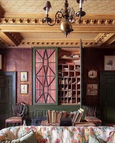 a living room filled with furniture and a chandelier