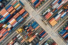 an aerial view of shipping containers at a port