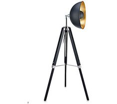 a black and gold tripod light on a white background