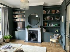 a living room filled with furniture and a fire place