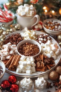 a plate filled with marshmallows, hot chocolate and other holiday treats