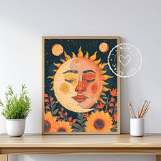 the sun and the moon are depicted in this colorful art print on a wall above a wooden table