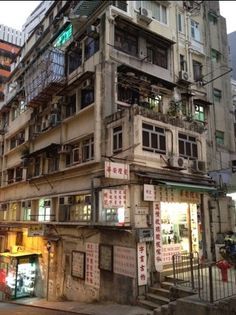 an old building with lots of windows and balconies on the side of it