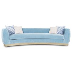 a blue couch with two pillows on it's back and one pillow in the middle