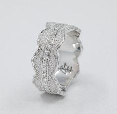 a white gold ring with diamonds on it