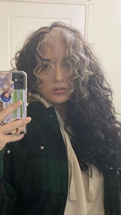 Streaks In Hair Curly, Front Hair Dyed Streaks Curly Hair, Narcissa Malfoy Curly Hair, White Streaks In Front Of Hair Curly, Curly Hair Streaks Highlights, Curly Brown Hair With White Streak, Skunk Stripe Hair Dye Curly Hair, Blonde Front Pieces Curly Hair, Dark Brown Curly Hair With Money Piece