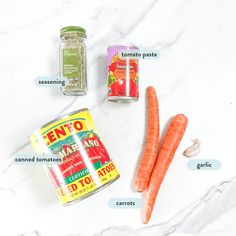 carrots, seasoning and spices on a marble counter top with labels labeled in english