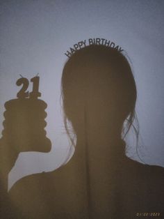 a woman's silhouette with the words happy birthday written on her head