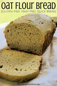 a loaf of oat flour bread sitting on top of a piece of parchment paper