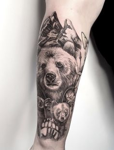 a man with a bear tattoo on his arm