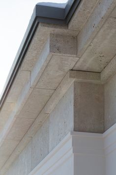 the corner of a building that has some concrete blocks on it