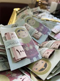 many different types of money are stacked on top of each other in this pile, with one woman's face cut out