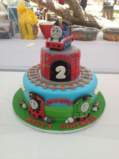 a thomas the train birthday cake on a table