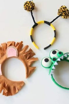 three different types of hair accessories on a white surface, one is made from paper and the other has fake animal ears