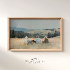 an oil painting of cows in a field with mountains in the background and wild country logo