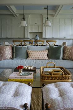 a living room filled with furniture and pillows