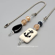 a necklace with an anchor and some beads