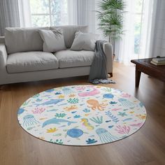 a living room with a couch and rug on the floor