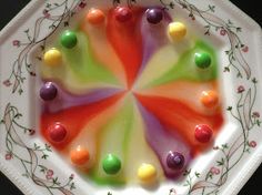 there is a plate with candy on it that looks like a starburst in the center