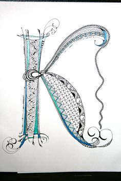 the letter k is made up of intricately designed letters and swirly designs on white paper