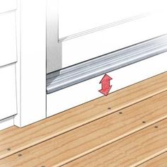 an image of a wooden floor with a red arrow pointing to the door seal on it