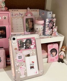 there are many items on the shelf in this room, including cell phones and dolls