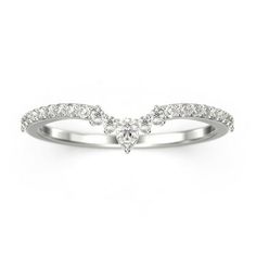 a white gold ring with diamonds on the side and an arrow shaped band around it