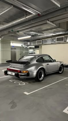 a car is parked in an empty parking garage