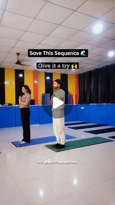 a man standing on top of a yoga mat in front of a woman with her hands behind her back