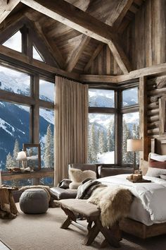 a bedroom with a large window overlooking the mountains