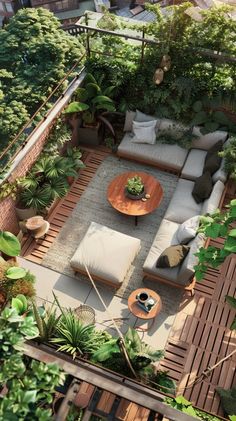 an aerial view of a patio with couches, tables and plants in the center