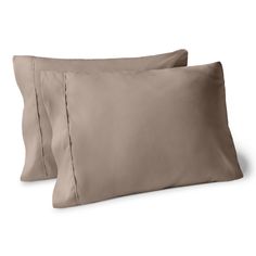 two pillows and one pillow case on a white background