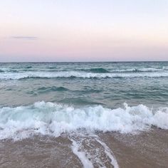 the waves are coming in to the beach and it looks like they have been washed ashore