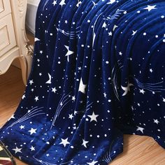 a blue blanket with white stars on it