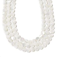 a strand of white glass beads on a white background