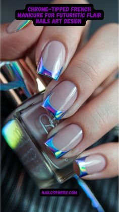 This close-up showcases an ultra-modern twist on the classic French manicure. The nails feature a nude, glossy base, elegantly topped with metallic chrome tips in mesmerizing, shifting iridescent hues. The chrome accents capture light from every angle, creating a dazzling rainbow-like sheen. This manicure perfectly combines subtle elegance with a bold, futuristic edge, ideal for those who want to stay ahead in the fashion game. Iridescent French Tips, Chrome Tipped Nails, Chrome Nails Designs French, Futuristic Nail Art, Chrome French Tips, Chrome Tips, Chrome French, Blue Nail Art Designs, Chrome Nails Designs