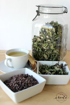 there are three bowls with different foods in them next to a glass jar filled with water