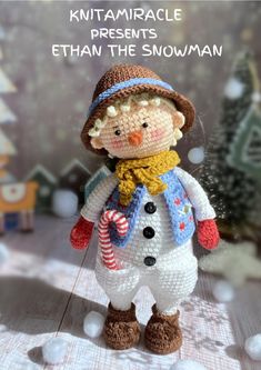 a crocheted snowman with a hat and scarf